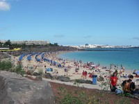 The crowded beach at Playa Blanca